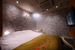 Postel nebo postele na pokoji v ubytování ホテルホワイトシティ23Adults only