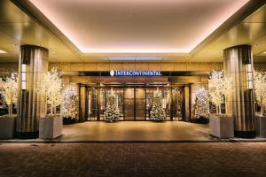a lobby of a building with christmas decorations at InterContinental Tokyo Bay by IHG in Tokyo