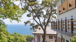 a view of the ocean from a building at Namhae Chocolate Pension in Namhae
