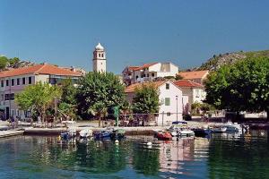 a group of boats are docked in a harbor at Apartments Niko in Skradin