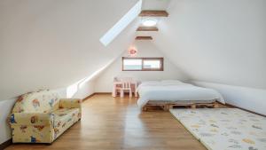 Postel nebo postele na pokoji v ubytování Jeju brickninemansion