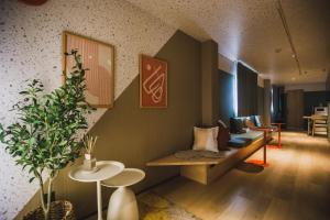 a living room with a couch and a table at R Residence 天下茶屋 IV in Osaka