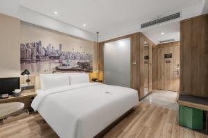 Voodi või voodid majutusasutuse Atour Hotel Chongqing Jiefangbei toas