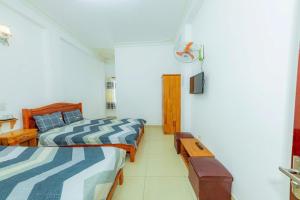 Postel nebo postele na pokoji v ubytování Reverie Hotel