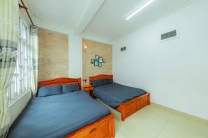 Postel nebo postele na pokoji v ubytování Reverie Hotel
