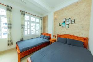 Postel nebo postele na pokoji v ubytování Reverie Hotel