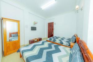 Postel nebo postele na pokoji v ubytování Reverie Hotel