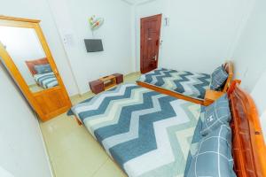 Postel nebo postele na pokoji v ubytování Reverie Hotel