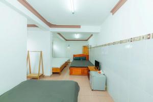 Postel nebo postele na pokoji v ubytování Reverie Hotel