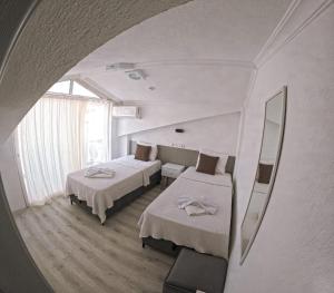 Ένα ή περισσότερα κρεβάτια σε δωμάτιο στο ULAŞ APART OTEL +23 φωτογραφίες