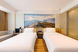 Voodi või voodid majutusasutuse Atour Hotel Chongqing Jiefangbei toas