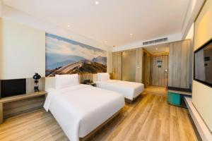 Voodi või voodid majutusasutuse Atour Hotel Chongqing Jiefangbei toas