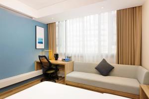 Voodi või voodid majutusasutuse Atour Hotel Chongqing Jiefangbei toas