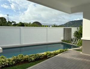 a swimming pool in the backyard of a house at Luxury villa Kamala Garden View by Lofty in Kamala Beach