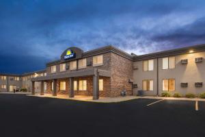 a hotel with a sign on the front of it at Days Inn by Wyndham Sioux Falls in Sioux Falls