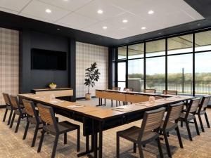 a large conference room with a large table and chairs at Origin Kansas City Riverfront, a Wyndham Hotel in Kansas City