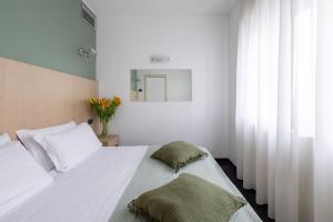 Postel nebo postele na pokoji v ubytování Energy Park Hotel