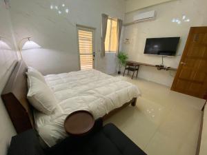 Letto o letti in una camera di Fangliao 9453 B&B