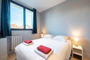 Ένα ή περισσότερα κρεβάτια σε δωμάτιο στο Annecy - Le 10