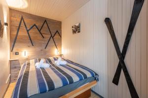 Postel nebo postele na pokoji v ubytování DIFY Grand Soleil - Courchevel 1650