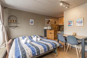 Postel nebo postele na pokoji v ubytování DIFY Grand Soleil - Courchevel 1650