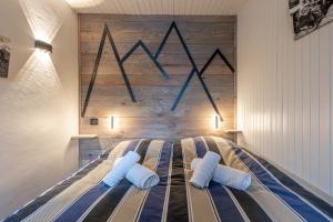 Postel nebo postele na pokoji v ubytování DIFY Grand Soleil - Courchevel 1650