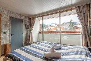 Postel nebo postele na pokoji v ubytování DIFY Grand Soleil - Courchevel 1650
