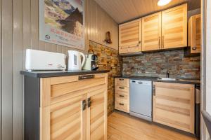 Kuchyň nebo kuchyňský kout v ubytování DIFY Grand Soleil - Courchevel 1650