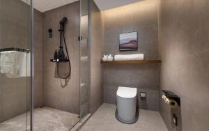 a bathroom with a shower stall and a toilet at Atour Hotel Kunming Tongde Plaza Beijing Road in Kunming