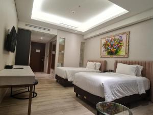 TV a/nebo společenská místnost v ubytování Trembesi Hotel