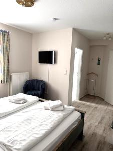 Postel nebo postele na pokoji v ubytování Hotel Villa Weststrand