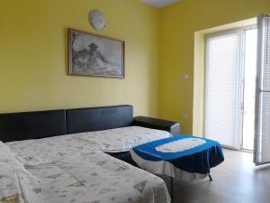 Postel nebo postele na pokoji v ubytování Apartment Nedo