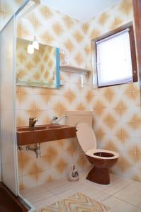 a bathroom with a toilet and a sink at Apartments Ruza in Supetarska Draga +33 photos