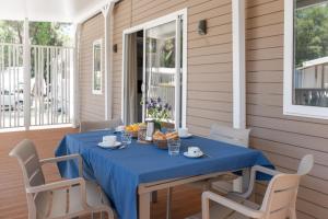 A balcony or terrace at Club del Sole Marina Romea Easy Camping Village