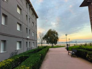 a building and a bench next to a building at Apartamento El Muro in Laredo