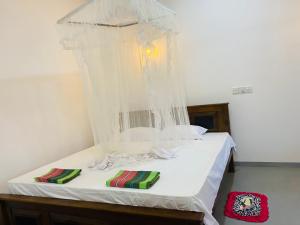 Postel nebo postele na pokoji v ubytování Bloom Guest House
