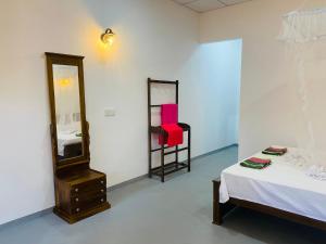Postel nebo postele na pokoji v ubytování Bloom Guest House