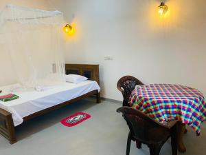 Postel nebo postele na pokoji v ubytování Bloom Guest House