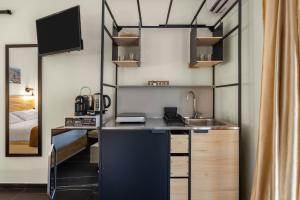 a kitchen with a counter and a sink in a room at Al Borghetto marinaro in Palermo +7 photos