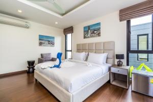 Postel nebo postele na pokoji v ubytování Phuket villa in Laguna Park + 26 fotografií