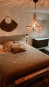 a bedroom with a large bed and a sink at Dune Du Clémot in Blankenberge +21 photos