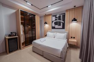 Ένα ή περισσότερα κρεβάτια σε δωμάτιο στο Tura Residence Sulimaniyah -ترى للشقق الفندقية السليمانية