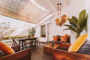 a living room with couches and a table at Hotel Bell Repos in Platja d'Aro