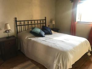 Postel nebo postele na pokoji v ubytování Villa Valeria Moralillo 1