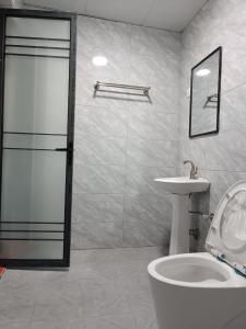 a bathroom with a shower and a toilet and a sink at Raya hotel juba in Juba