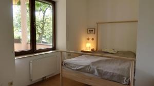Postel nebo postele na pokoji v ubytování Villa Gartenblick