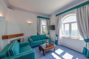 Posezení v ubytování AMORE RENTALS - Villa Jacaranda