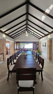 a large conference room with a long table and chairs at Villa Fantasy private beach and private pool in Rio Bueno