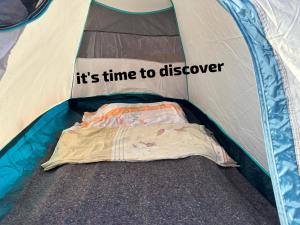 Ένα ή περισσότερα κρεβάτια σε δωμάτιο στο Time to Discover Wild Camp