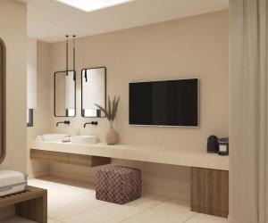 Telewizja i/lub zestaw kina domowego w obiekcie Τhe Noverian Antama Organic Beach Resort Chania